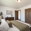 Bedroom with bed, dresser, window,  and closet| Brentwood II Bismarck, ND