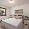 Garden Grove | Mandan, ND  - Bedroom with bed, night stands, and a window
