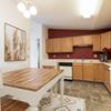 a kitchen with a two chair table Fairview | Bismarck, ND