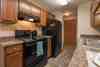 A kitchen with black appliances  Parkview Arms | Bismarck, ND