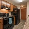 A kitchen with black appliances  Parkview Arms | Bismarck, ND